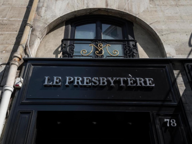 Entrance to historic luxury hotel Le Presbytère in Paris